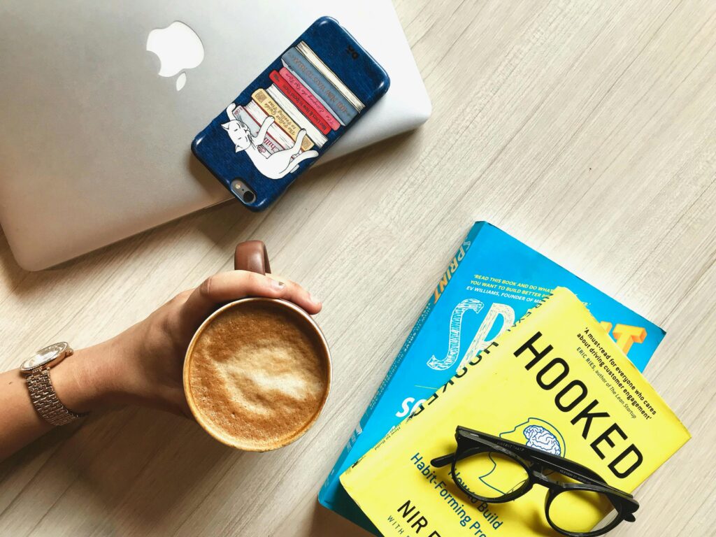 A business man drinking a coffee and ready to read books to become a better professional and master Business French