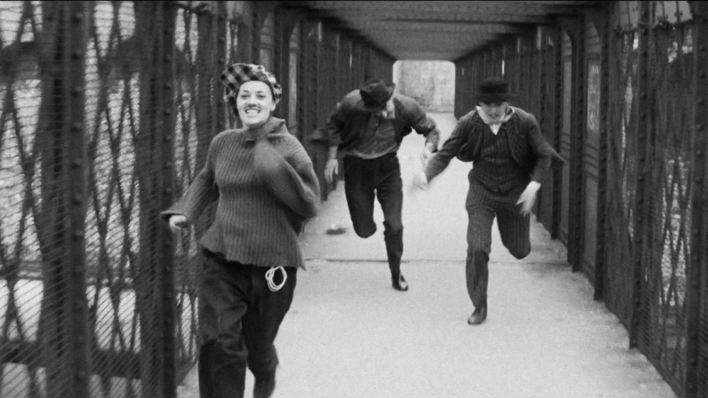 Jeanne Moreau runs with her two love friends, an image that captures the essence of French romantism and love triangle