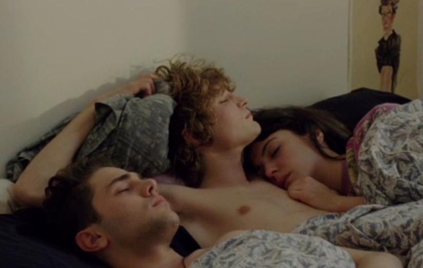 It looks like the protagonists from the Movie Heartbeats are having a ménage à trois. They sleep all together in a small bed with the blond attractive guy in the middle