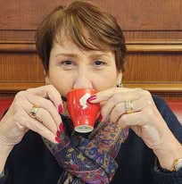 American retiree drinks cafe in France Retire in France in your 60's