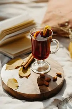 Warm autumn scene featuring mulled wine, almonds, and cozy elements for a relaxing atmosphere. Vin chaud en France