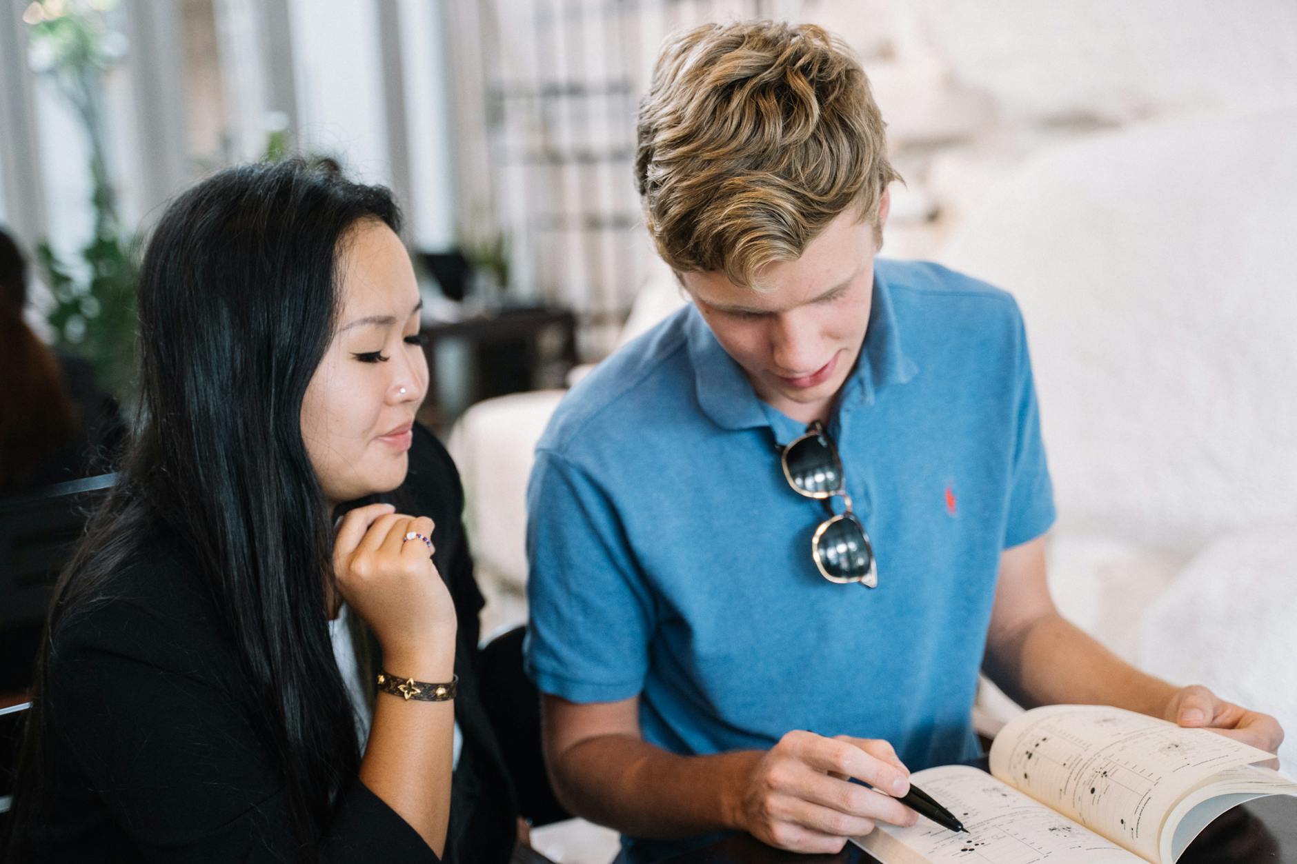 A Sydney learner studying French in a café or library setting.