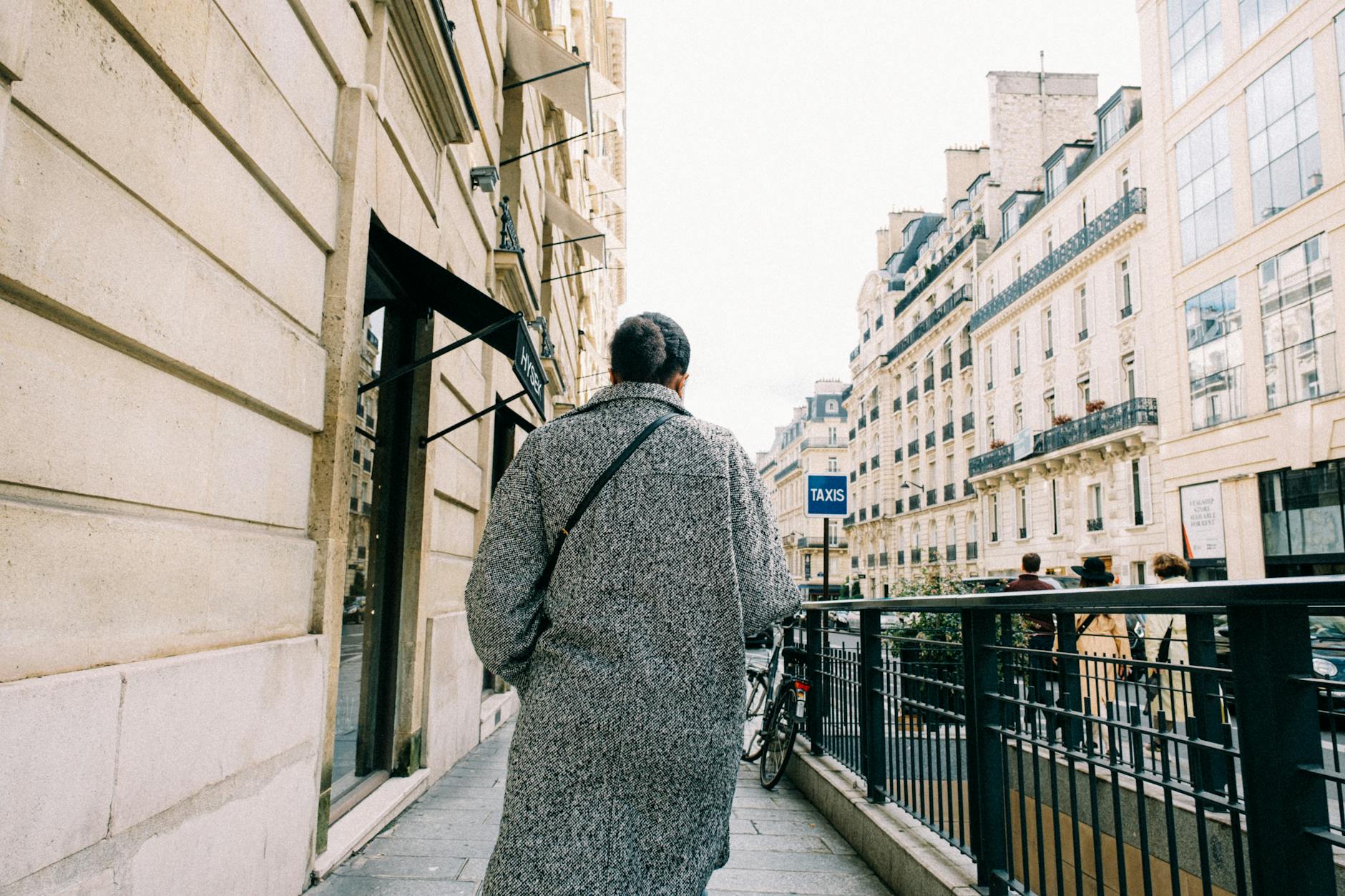 An expat walking through a French neighbourhood while learning to integrate.