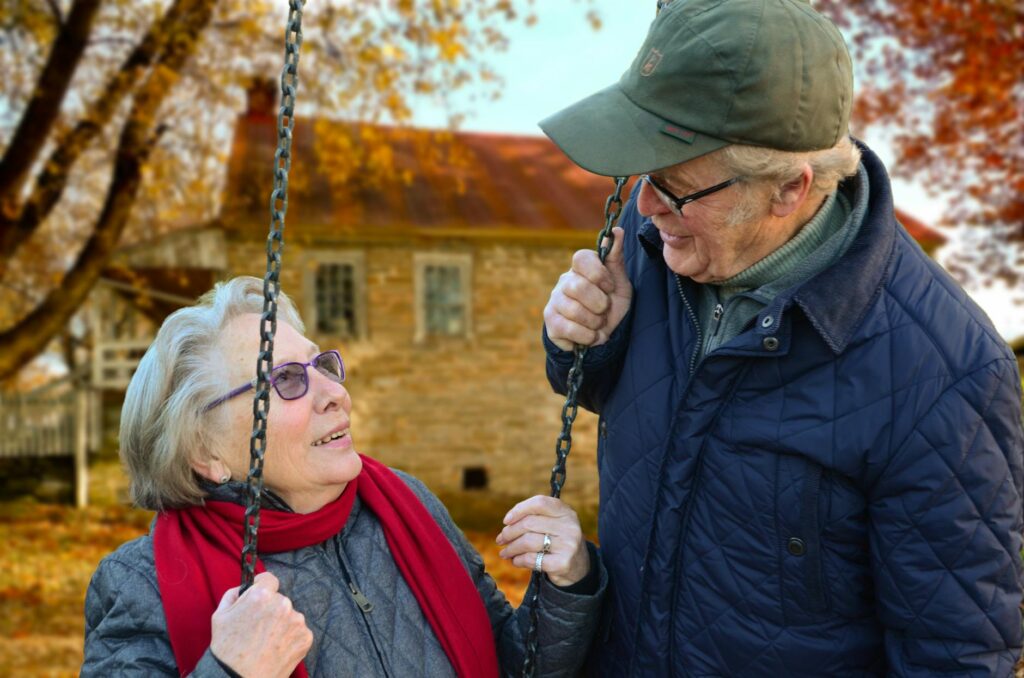 An older learner or couple using French vocabulary notes for retirement in France.