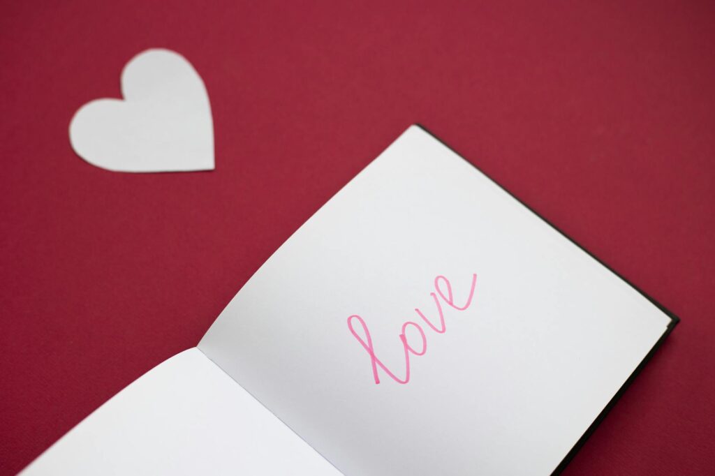 A notebook with French notes about aimer, like, and love.