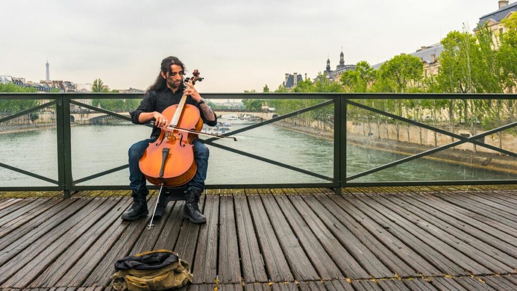 Street musicians performing as people gather on a summer evening in Paris