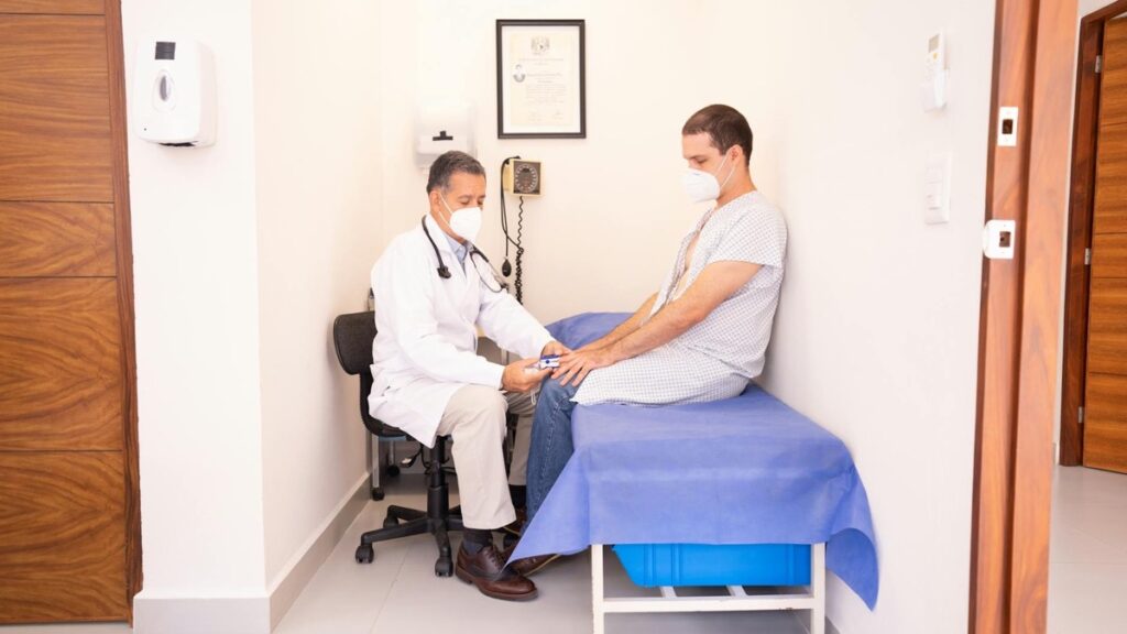 Adult patient speaking with a doctor during a calm appointment