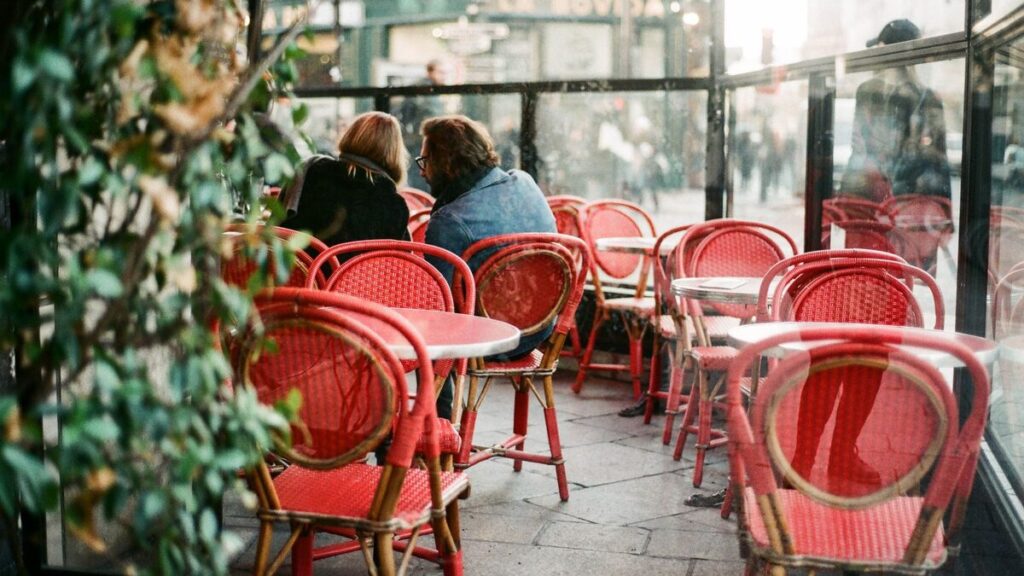 Adult French learner preparing phrases for everyday life in France