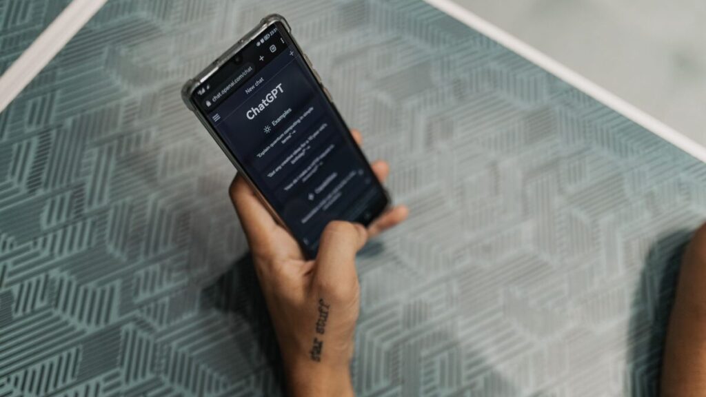 Adult French learner using an AI language learning app before a real conversation in France