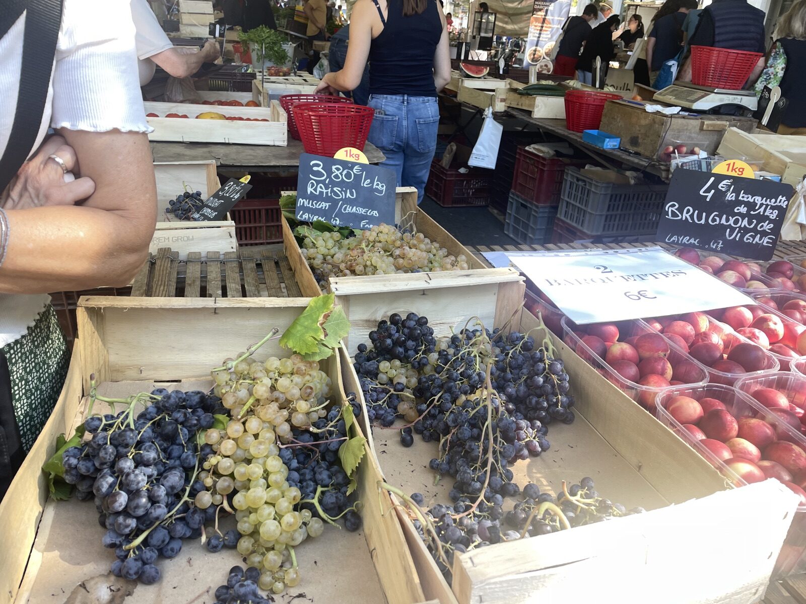 Fresh grapes and peaches for sale at a French market