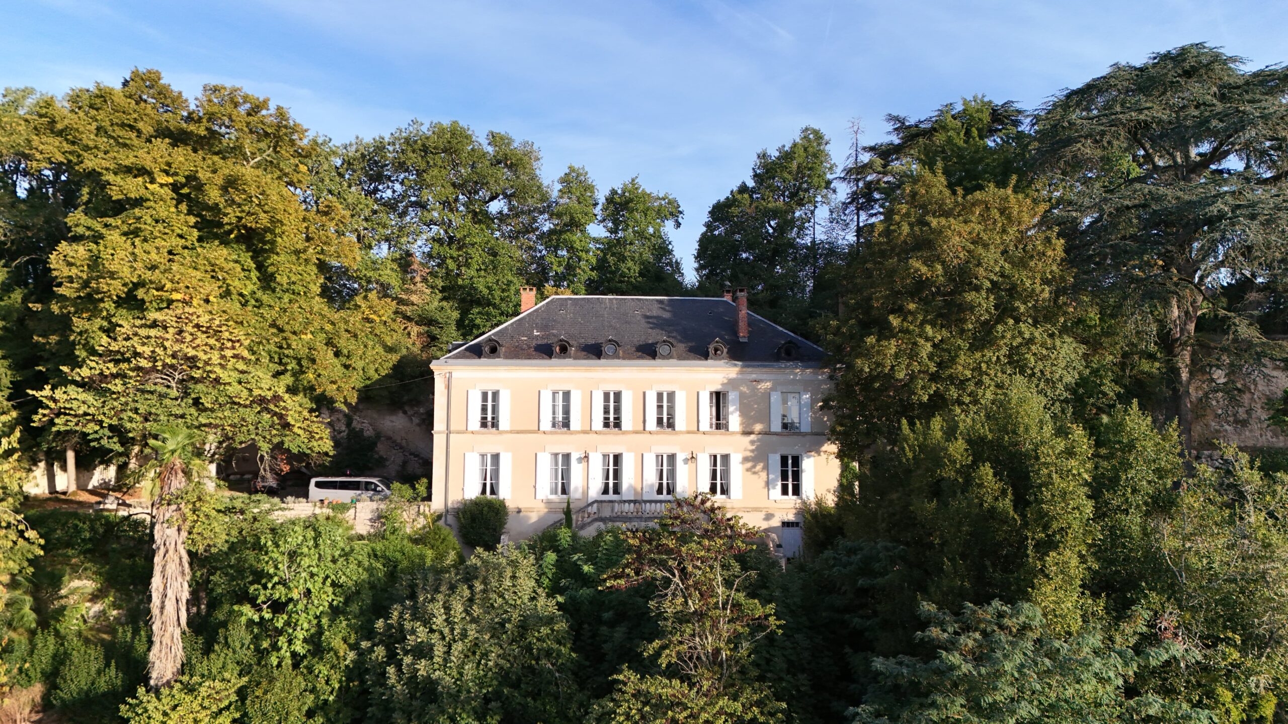 Château de Borie surrounded by trees in southwest France